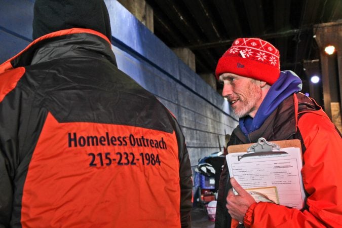 Luke Dunn talks to a homeless man and takes down his contact to make sure he gets entered into the homeless database, and promises to return for a referral for an I.D.