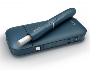 Philip Morris' iQOS device heats tobacco but stops short of burning it, an approach the company says reduces exposure to tar and other toxic byproducts of burning cigarettes. (Philip Morris via AP)