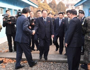 With North Korea planning to participate in the 2018 Winter Olympics, delegation head Jon Jong Su, vice chairman of the Committee for the Peaceful Reunification of the Country, crosses the concrete border to attend a meeting at the truce village of Panmunjom in the demilitarized zone separating the two Koreas.
(Yonhap via Reuters)