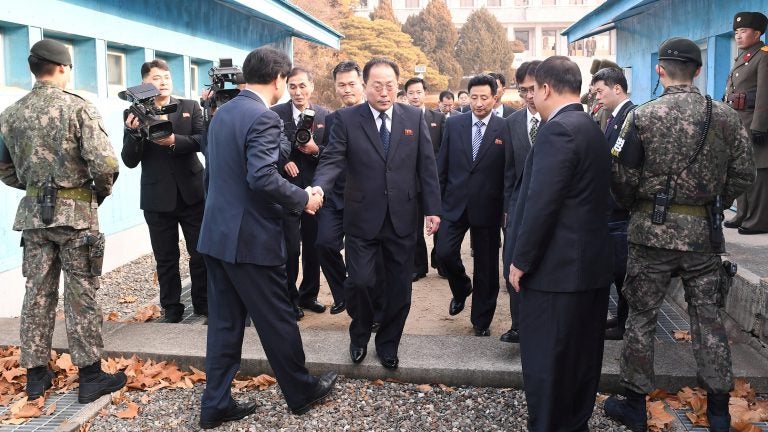 With North Korea planning to participate in the 2018 Winter Olympics, delegation head Jon Jong Su, vice chairman of the Committee for the Peaceful Reunification of the Country, crosses the concrete border to attend a meeting at the truce village of Panmunjom in the demilitarized zone separating the two Koreas.
(Yonhap via Reuters)
