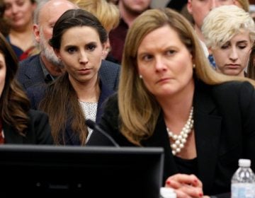 The entire USA Gymnastics board will resign, the group says. Rachael Denhollander (center) listens as Larry Nassar, a former team USA Gymnastics doctor, was sentenced to up to 175 years in prison for sexual abuse over decades of his involvement with the program.