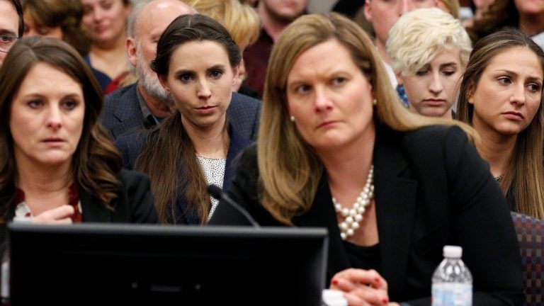 The entire USA Gymnastics board will resign, the group says. Rachael Denhollander (center) listens as Larry Nassar, a former team USA Gymnastics doctor, was sentenced to up to 175 years in prison for sexual abuse over decades of his involvement with the program.