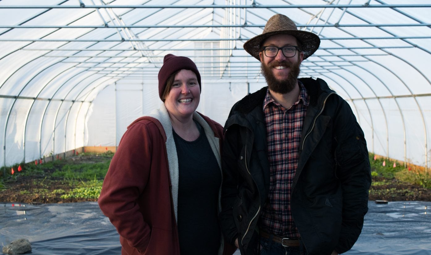 Hannah Clark and Ryan Anderson inside their hoop house.