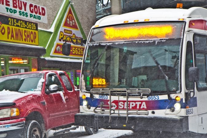 Snow and ice coat a SEPTA bus on Jasper Street in Kensington. (Kimberly Paynter/WHYY)