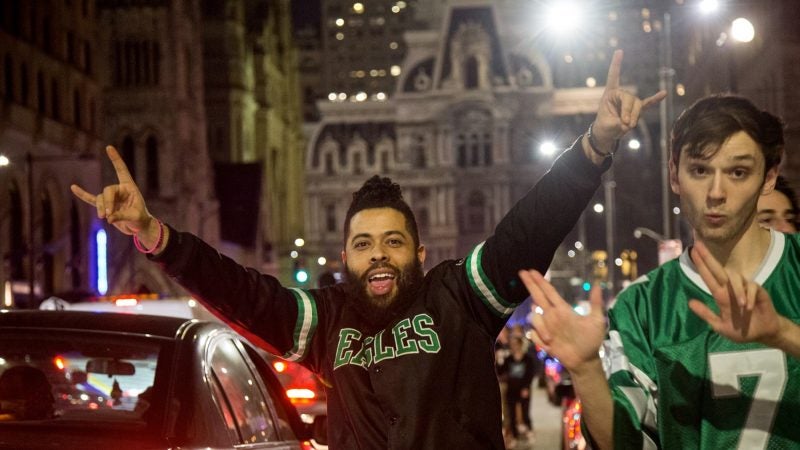 Fans celebrate after the Eagles win the NFC championships and secure a spot in the Super Bowl. (Emily Cohen for WHYY)