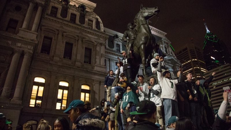 Fans celebrate after the Eagles win the NFC championships and secure a spot in the Super Bowl. (Emily Cohen for WHYY)