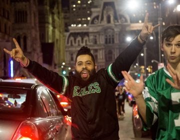 Fans celebrate after the Eagles win the NFC championships and secure a spot in the Super Bowl.