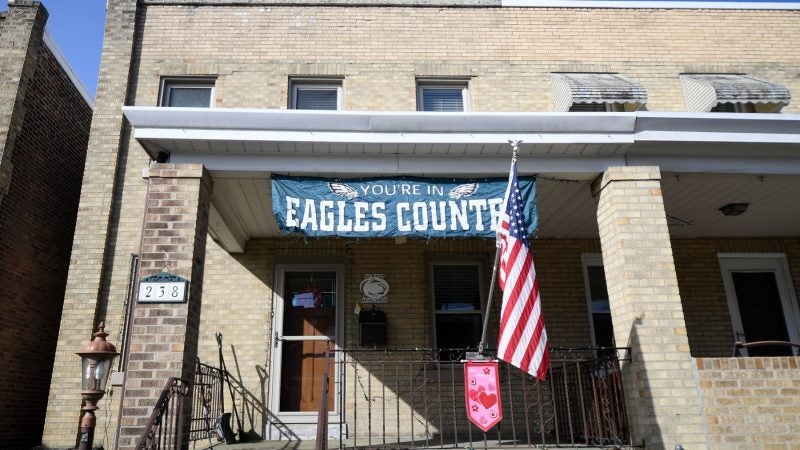 A flag in support of the Philadelphia Eagles hangs on the front porch of a home in Roxborough, on Wednesday. (Bastiaan Slabbers for WHYY)