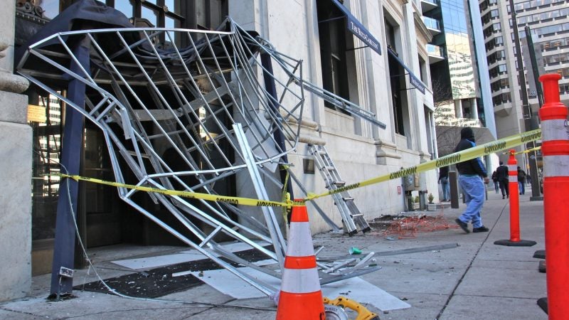 Celebrating Eagles fans bounced on the awning at the Ritz-Carlton hotel in Center City until it collapsed. (Emma Lee/WHYY)