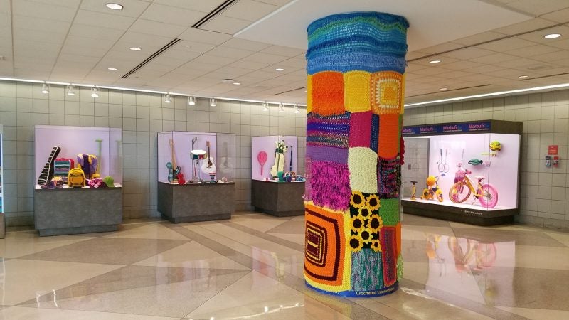 A yarnbomb installation at the Philadelphia airport by the street artist Marbufs. (Peter Crimmins/WHYY)