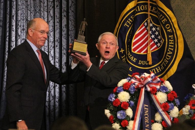 Attorney General Jeff Sessions (right) receives the Lincoln Award from Union League President James P. Dunigan. Sessions was the keynote speaker at the Union League's Lincoln Day celebration. (Emma Lee/WHYY)