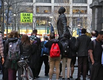 About 50 people gathered at the statue of Octavius Catto to remember the victims of gun violence and to call for gun control legislation. (Emma Lee/WHYY)