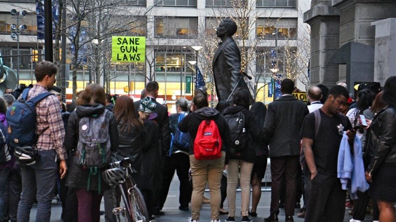 About 50 people gathered at the statue of Octavius Catto to remember the victims of gun violence and to call for gun control legislation. (Emma Lee/WHYY)