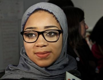 Nasihah Thompson-King talks with reporters after a press conference at Mastery Shoemaker Charter School. Her supporters called for an end to the requirement that hijab-wearing students obtain a waiver after Nasihah was prevented from playing because she refused to take off her head covering.