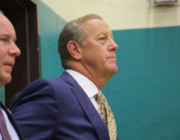 Cherry Hill Mayor Chuck Cahn joins the more than 200 in attendance at the Cherry Hill school board meeting Tuesday night, where a long list of speakers sounded off about school security and administrative gaffes at Cherry Hill East High School. (Emma Lee/WHYY)