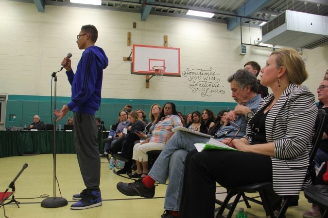 High School students line up to speak at a Cherry Hill school board meeting Tuesday night. In the two weeks since the school shooting in Parkland, Florida, Cherry Hill East High School has seen student protests over school safety and the removal of a well-liked teacher. (Emma Lee/WHYY)