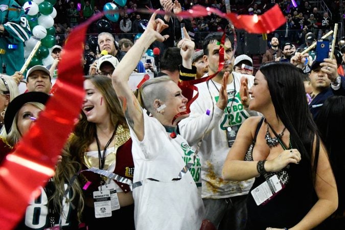 Molly Schuyler wins the event by consuming the record-breaking amount of 501 wings, during Wing Bowl 26, at the Wells Fargo Center, on Friday. (Bastiaan Slabbers for WHYY)