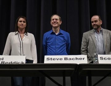 Rachel Reddick, Steve Bacher, and Scott Wallace, candidates for the Democratic nomination in the newly-drawn 1st Congressional District, attend a candidate forum in Newtown, Pa. on Tuesday evening. (Bastiaan Slabbers/for WHYY)