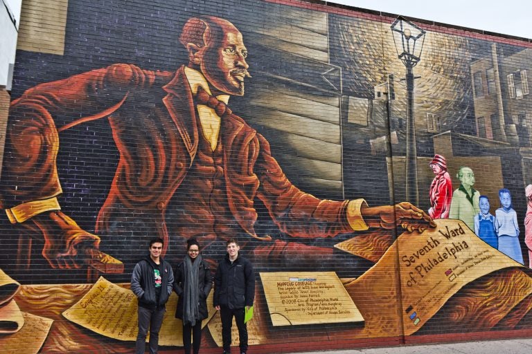 (From left) Penn students Ramon Garcia-Gomez, Helen Fetaw, and Nathaniel Gertzman, tour the 7th Ward. They read about W. E. B. Du Bois and his research in Philadelphia as part of their African American History class. (Kimberly Paynter/WHYY)