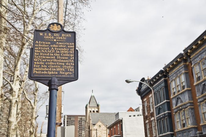 Ramon Garcia-Gomez, a University of Pennsylvania philosophy politics and economics major, said he hopes people will stop and read the historical markers in the 7th Ward. (Kimberly Paynter/WHYY)