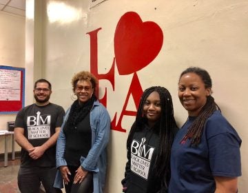 Rich Liuzzi, left, is the director of school and community partnerships at Lea Elementary who took eighth-graders to see Black Panther and thought all the school's students should see it. Aja Graydon-Dantzler, a Lea parent, Tiguida Kaba, a Lea student, and Lea principal Shavon Savage worked to support the effort that raised enough money to finance the movie field trip in less than 24 hours.