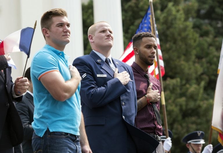 In this Sept. 11, 2015 file photo, Oregon National Guardsman Alek Skarlatos, (left), U.S. Airman Spencer Stone, (center), and Anthony Sadler attend a parade held in their honor in Sacramento, Calif. The wait is almost over to see Roseburg, Ore., hero Skarlatos on the big screen in 