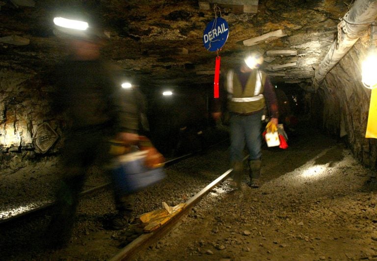 FILE - In this March 10, 2006 file photo, Ohio coal miners head into the mine for a shift inside the Hopedale Mine near Cadiz, Ohio.