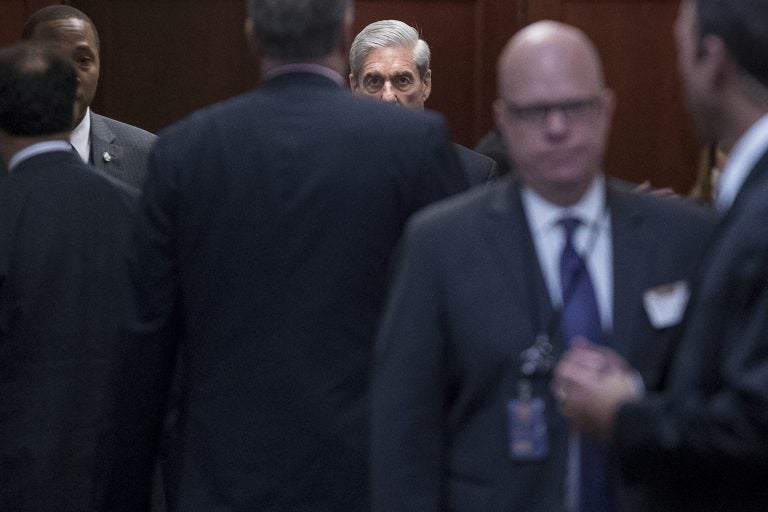 Former FBI Director Robert Mueller, center, the special counsel probing Russian interference in the 2016 election, arrives on Capitol Hill for a closed door meeting, Wednesday, June 21, 2017, in Washington.