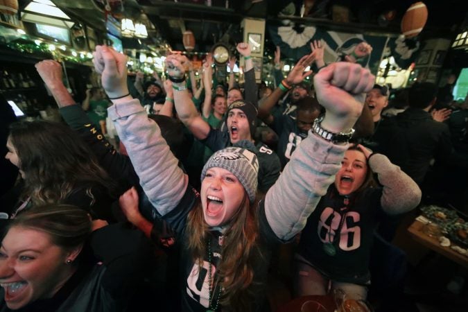 Philadelphia Eagles fans in Philadelphia react while watching the first quarter of the NFL Super Bowl 52 football game between the Eagles and the New England Patriots in Minneapolis, Sunday, Feb. 4, 2018.