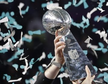 Philadelphia Eagles' Carson Wentz holds up the Vince Lombardi Trophy after the NFL Super Bowl 52 football game against the New England Patriots, Sunday, Feb. 4, 2018, in Minneapolis. The Eagles won 41-33. (AP Photo/Matt Slocum)