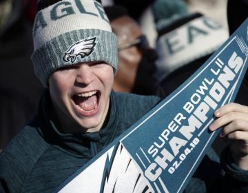 A Philadelphia Eagles fan chants while waiting for the team to arrive in Philadelphia at Philadelphia International Airport a day after defeating the New England Patriots in Super Bowl 52 in Minneapolis, Monday, Feb. 5, 2018. (AP Photo/Julio Cortez)