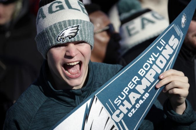 A Philadelphia Eagles fan chants while waiting for the team to arrive in Philadelphia at Philadelphia International Airport a day after defeating the New England Patriots in Super Bowl 52 in Minneapolis, Monday, Feb. 5, 2018. (AP Photo/Julio Cortez)