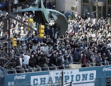 Philadelphia Eagles NFL football players celebrate on a bus passing fans during a Super Bowl victory parade, Thursday, Feb. 8, 2018, in Philadelphia. The Eagles beat the New England Patriots 41-33 in Super Bowl 52. (AP Photo/Matt Slocum)