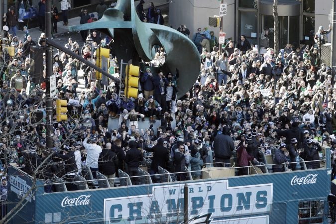 Philadelphia Eagles NFL football players celebrate on a bus passing fans during a Super Bowl victory parade, Thursday, Feb. 8, 2018, in Philadelphia. The Eagles beat the New England Patriots 41-33 in Super Bowl 52. (AP Photo/Matt Slocum)