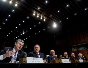 (From left) FBI Director Christopher Wray, accompanied by CIA Director Mike Pompeo, Director of National Intelligence Dan Coats, Defense Intelligence Agency Director Robert Ashley, National Security Agency Director Adm. Michael Rogers, and National Geospatial-Intelligence Agency Director Robert Cardillo, speaks at a Senate Select Committee on Intelligence hearing on worldwide threats, Tuesday, Feb. 13, 2018, in Washington. (Andrew Harnik/AP Photo)