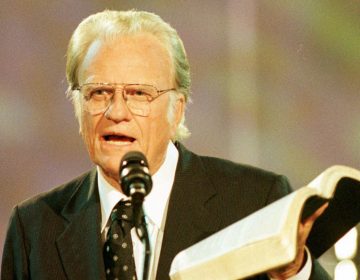 Rev. Billy Graham reads from the Bible during the third night of the Carolinas Billy Graham Crusade at Ericsson Stadium in Charlotte, N.C., Saturday, Sept. 28, 1996. The crusade runs through Sunday, Sept. 29.