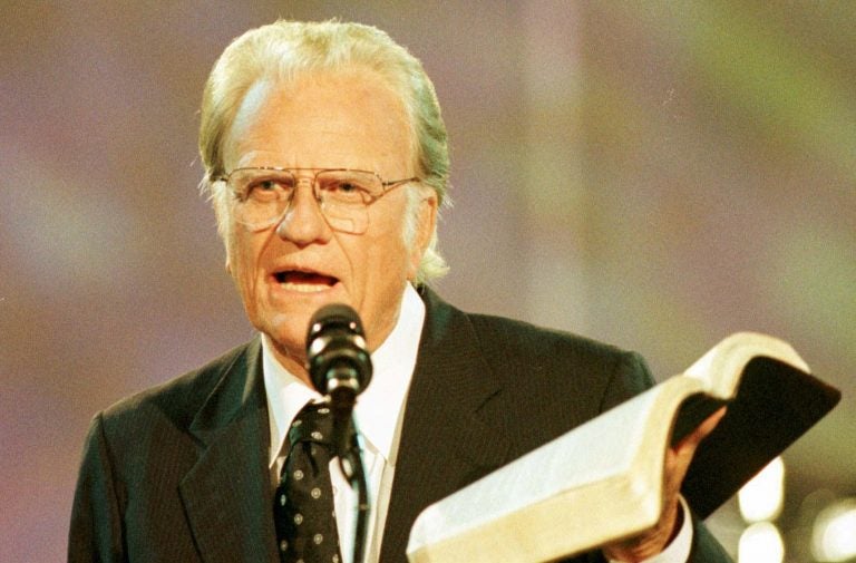 Rev. Billy Graham reads from the Bible during the third night of the Carolinas Billy Graham Crusade at Ericsson Stadium in Charlotte, N.C., Saturday, Sept. 28, 1996. The crusade runs through Sunday, Sept. 29.