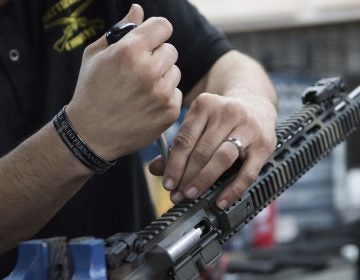 In this photo taken March 15, 2017, Karl Sorken, production manager for Battle Rifle Co., based in Webster, Texas, works on the rails of an AR-15style rifle. Battle Rifle is one of now more than 10,000 gunmakers in the United States. (Lisa Marie Pane/AP Photo)