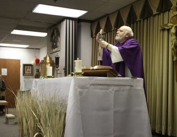 The Rev. Eugene Bettinger celebrates Mass at the Chapel on the Mall on Ash Wednesday last year in Paramus. New Jersey has the second-highest concentration of Catholics in the country.  (Seth Wenig/AP Photo)