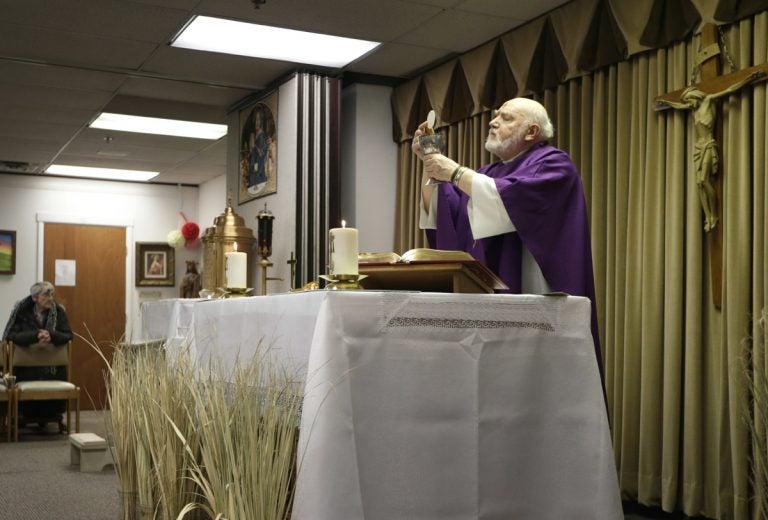 The Rev. Eugene Bettinger celebrates Mass at the Chapel on the Mall on Ash Wednesday last year in Paramus. New Jersey has the second-highest concentration of Catholics in the country.  (Seth Wenig/AP Photo)