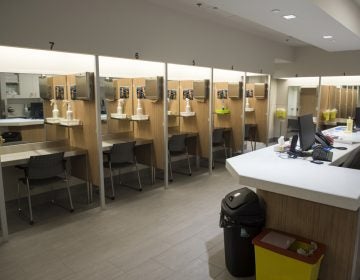 Booths line the Cactus safe-injection site where drug addicts can shoot up using clean needles, get medical supervision, and freedom from arrest in Montreal.  (Paul Chiasson/The Canadian Press via AP)