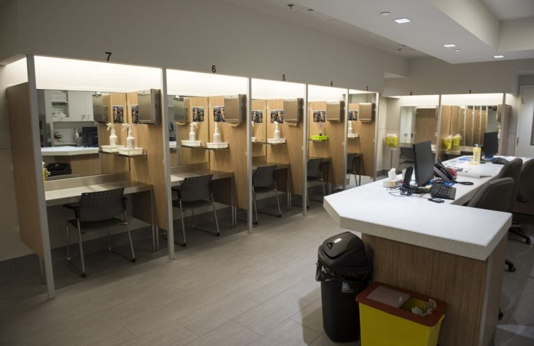 Booths line the Cactus safe-injection site where drug addicts can shoot up using clean needles, get medical supervision, and freedom from arrest in Montreal.  (Paul Chiasson/The Canadian Press via AP)