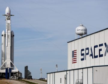 A Falcon 9 SpaceX heavy rocket stands ready for launch on pad 39A at the Kennedy Space Center in Cape Canaveral, Fla., Monday, Feb. 5, 2018. The Falcon Heavy scheduled to launch Tuesday afternoon, has three first-stage boosters, strapped together with 27 engines in all. (Terry Renna/AP Photo)