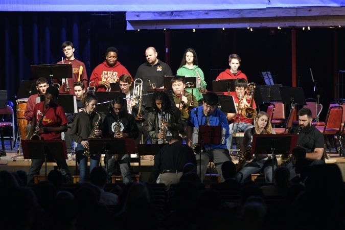 Kelce joins the jazz band of his alma mater, Cleveland Heights High School, on stage during an exchange program visit at Central High School, in Philadelphia, Pa., on February 22, 2018. (Bastiaan Slabbers/for WHYY)