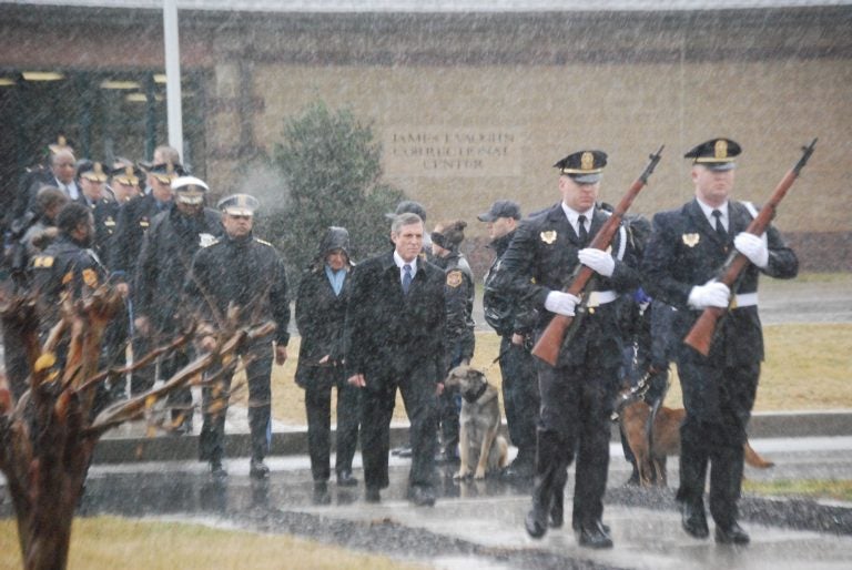 Delaware Gov. John Carney, center, participates in a memorial service for Lt. Steven Floyd. Floyd was killed in the February 2017 prison uprising at the Vaughn Correctional Center in Smyrna. (John Jankowski/for WHYY)