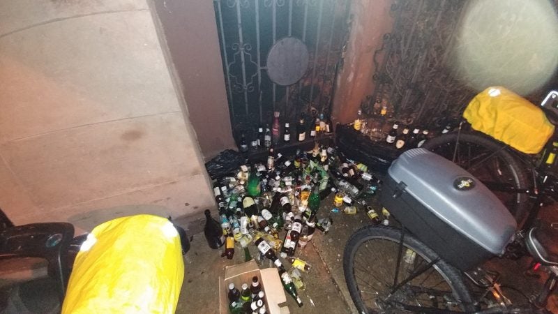 Philadelphia police on the job confiscating bottles at eagles party