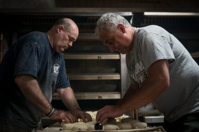 Marty Cunningham, on the left, and Louis Caranagi prep rolls at Carangi Baking Co. & Cafe in South Philadelphia in preparation for the Super Bowl on January 4, 2018.