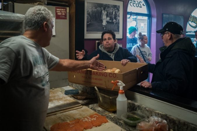 Louis Caranagi speaks with customers about their game day orders before the Super Bowl at Carangi Baking Co. & Cafe in South Philadelphia on January 4, 2018.