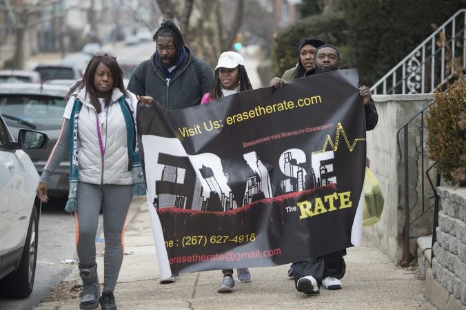 Davida Garner, center, and family members begin the Walk to End Homicide in the Oak Lane Section of the city.(Jonathan Wilson for WHYY)