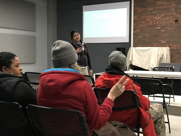 Amanda Fury listens to a resident's comment during a presentation on neighborhood conditions at a recent meeting of Somerset Neighbors for Better Living.